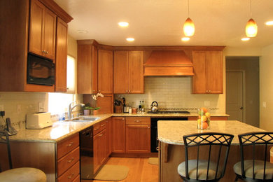 Mid-sized transitional galley light wood floor eat-in kitchen photo in San Francisco with a double-bowl sink, recessed-panel cabinets, medium tone wood cabinets, granite countertops, multicolored backsplash, stainless steel appliances and an island