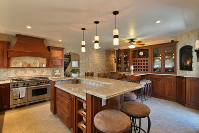 Example of a large classic l-shaped ceramic tile eat-in kitchen design in San Diego with a double-bowl sink, raised-panel cabinets, medium tone wood cabinets, granite countertops, beige backsplash, stone slab backsplash, stainless steel appliances and an island