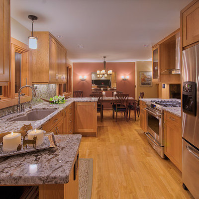 Example of a mid-sized classic galley eat-in kitchen design in Denver with an undermount sink, shaker cabinets, medium tone wood cabinets, mosaic tile backsplash and stainless steel appliances