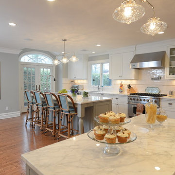 Flat Panel White Paint Flush Inset Cabinetry with Gorgeous Marble Counter tops