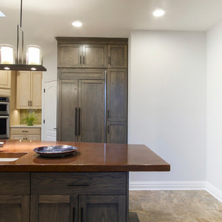 Inspiration for a mid-sized contemporary u-shaped separate kitchen in New York with a single-bowl sink, recessed-panel cabinets, dark wood cabinets, concrete benchtops, yellow splashback, glass tile splashback, panelled appliances, ceramic floors, with island and grey floor.
