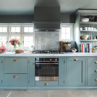 Design ideas for a small traditional kitchen in Sussex.