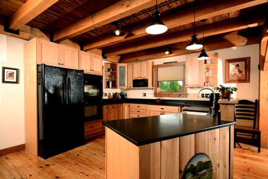 Kitchen - mid-sized craftsman u-shaped light wood floor kitchen idea in Bridgeport with a farmhouse sink, shaker cabinets and light wood cabinets