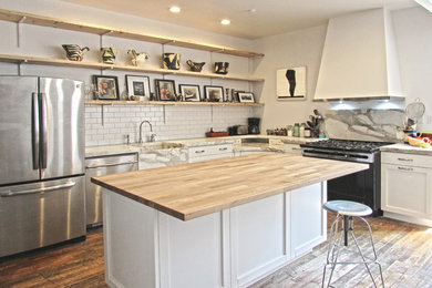 Transitional l-shaped medium tone wood floor and beige floor eat-in kitchen photo in New York with a farmhouse sink, open cabinets, white cabinets, wood countertops, gray backsplash, stone slab backsplash, stainless steel appliances and an island