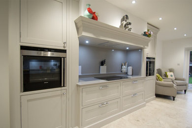 Framed bespoke kitchen in soft grey