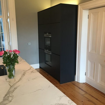 Freestanding contemporary kitchen in period room