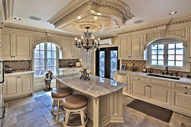 Example of a large ornate u-shaped porcelain tile open concept kitchen design in Philadelphia with a single-bowl sink, raised-panel cabinets, beige cabinets, marble countertops, multicolored backsplash, ceramic backsplash, stainless steel appliances and an island