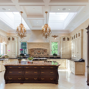 French Chateau Kitchen with antique island, Skylights, Wood Millwork Refrigerato