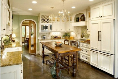 Inspiration for a modern kitchen remodel in Dallas with a farmhouse sink, glass-front cabinets, distressed cabinets, granite countertops, green backsplash and stainless steel appliances