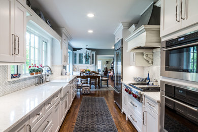 Elegant galley kitchen photo in Wichita with shaker cabinets and white cabinets