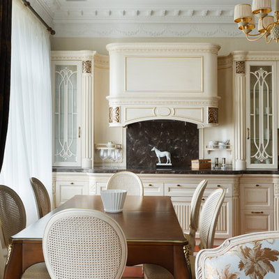 Open concept kitchen - mid-sized traditional single-wall open concept kitchen idea in Saint Petersburg with glass-front cabinets, beige cabinets and an island
