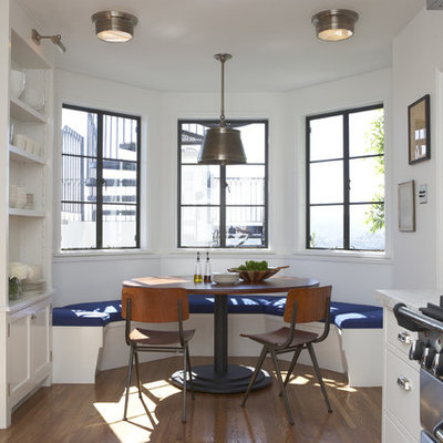 Eat-in kitchen - transitional eat-in kitchen idea in Los Angeles with white cabinets and stainless steel appliances