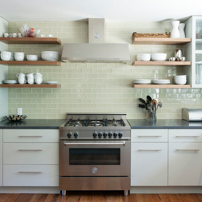 Inspiration for a contemporary kitchen remodel in Austin with open cabinets, white cabinets, concrete countertops, green backsplash, glass tile backsplash and stainless steel appliances