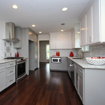 Fresh and bright complete kitchen remodel with dual tone cabinetry