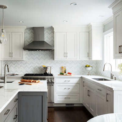 Small transitional u-shaped dark wood floor and brown floor eat-in kitchen photo in New York with an undermount sink, white backsplash, mosaic tile backsplash, stainless steel appliances, an island, white countertops, shaker cabinets and gray cabinets