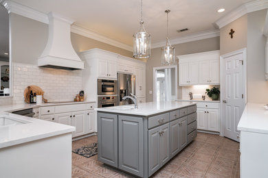 Mid-sized elegant l-shaped ceramic tile and beige floor open concept kitchen photo in Other with a double-bowl sink, raised-panel cabinets, white cabinets, wood countertops, white backsplash, ceramic backsplash, stainless steel appliances and an island