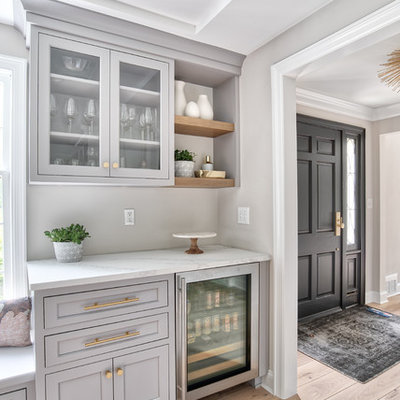 Kitchen - large transitional kitchen idea in New York with an undermount sink, beaded inset cabinets, white cabinets, quartz countertops, white backsplash, mosaic tile backsplash, paneled appliances, an island and white countertops