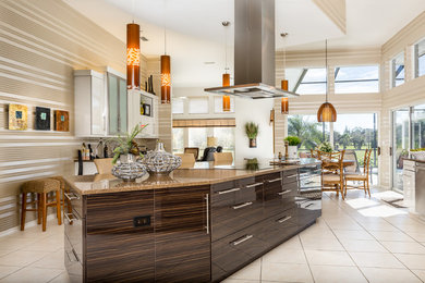 Inspiration for a large contemporary u-shaped ceramic tile eat-in kitchen remodel in Miami with a drop-in sink, flat-panel cabinets, white cabinets, stainless steel appliances, an island, quartz countertops, brown backsplash and matchstick tile backsplash