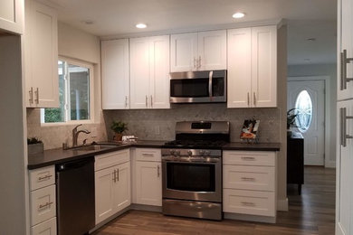 Full kitchen remodel" Cabinets, tile, laminate floor, lighting, appliances