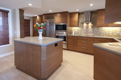 Kitchen - mid-sized contemporary u-shaped porcelain tile and beige floor kitchen idea in San Diego with an undermount sink, flat-panel cabinets, medium tone wood cabinets, quartz countertops, gray backsplash, matchstick tile backsplash, stainless steel appliances and an island