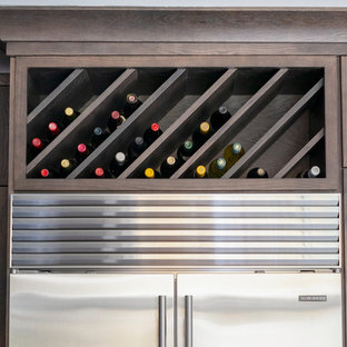 Design ideas for a mid-sized transitional u-shaped eat-in kitchen in Chicago with an undermount sink, shaker cabinets, dark wood cabinets, quartz benchtops, ceramic splashback, stainless steel appliances, porcelain floors, with island, multi-coloured floor, white benchtop and beige splashback.