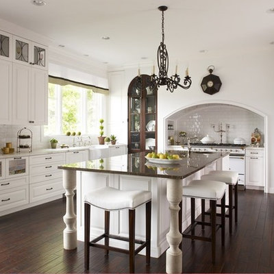 Inspiration for a large timeless kitchen remodel in Detroit with a farmhouse sink, raised-panel cabinets, white cabinets, white backsplash and subway tile backsplash