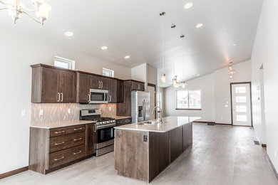 Mid-sized trendy single-wall light wood floor and gray floor eat-in kitchen photo in Other with an undermount sink, shaker cabinets, dark wood cabinets, quartz countertops, gray backsplash, glass tile backsplash, stainless steel appliances, an island and white countertops