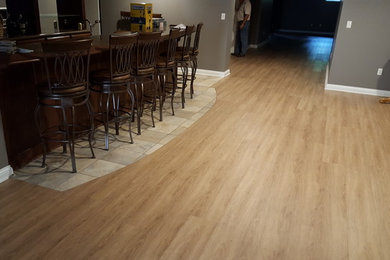 Example of a mid-sized light wood floor and beige floor kitchen design in Indianapolis