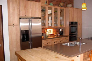 Kitchen - traditional kitchen idea in Other with light wood cabinets and stainless steel appliances