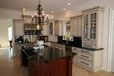 Large transitional u-shaped dark wood floor eat-in kitchen photo in Baltimore with a double-bowl sink, raised-panel cabinets, light wood cabinets, granite countertops, black backsplash, stainless steel appliances and no island
