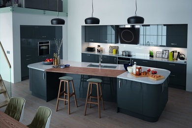 Inspiration for a contemporary kitchen in Cheshire with flat-panel cabinets, granite worktops and an island.