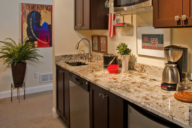 Example of a small trendy single-wall carpeted and beige floor eat-in kitchen design in Philadelphia with an undermount sink, shaker cabinets, dark wood cabinets, granite countertops, beige backsplash and stainless steel appliances