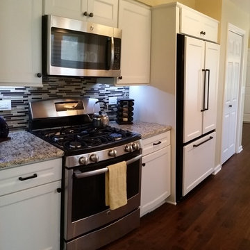 Galley Kitchen with Refaced White Cabinetry