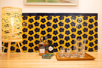 Kitchen - small eclectic single-wall kitchen idea in San Diego with multicolored backsplash and ceramic backsplash