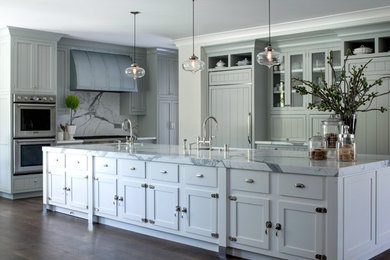 Example of a large farmhouse galley medium tone wood floor eat-in kitchen design in San Francisco with an undermount sink, shaker cabinets, blue cabinets, marble countertops, white backsplash, stone slab backsplash, stainless steel appliances and an island