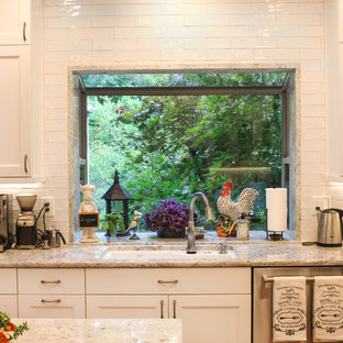 Large transitional eat-in kitchen designs - Large transitional u-shaped medium tone wood floor and brown floor eat-in kitchen photo in Seattle with an undermount sink, shaker cabinets, white cabinets, granite countertops, white backsplash, subway tile backsplash, stainless steel appliances, an island and white countertops