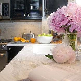 Mid-sized transitional kitchen photo in DC Metro with a single-bowl sink, recessed-panel cabinets, black cabinets, marble countertops, white backsplash, stone tile backsplash and stainless steel appliances