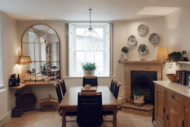 This is an example of a large classic open plan dining room in Other with limestone flooring and beige floors.