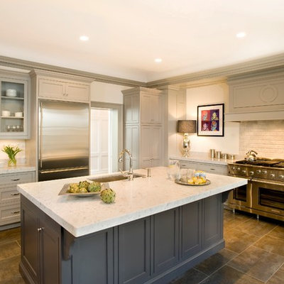 Example of a classic kitchen design in Boston with stainless steel appliances, a single-bowl sink, gray cabinets, beige backsplash and beaded inset cabinets