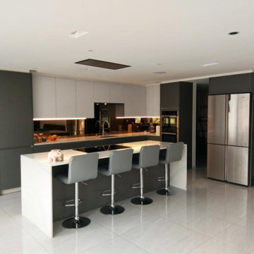 German Kitchen in Brentford by  Kudos Interior Designs