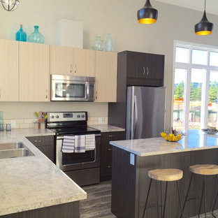 Design ideas for a small beach style l-shaped open plan kitchen in Calgary with a double-bowl sink, flat-panel cabinets, distressed cabinets, laminate benchtops, beige splashback, ceramic splashback, stainless steel appliances, medium hardwood floors and with island.