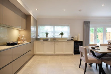 Photo of a large kitchen/diner in West Midlands with coloured appliances and no island.