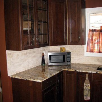 Glass cabinetry and tiger-eye granite countertops