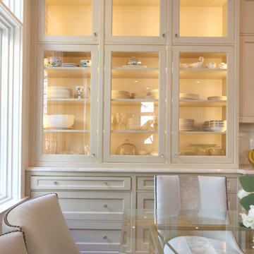 Glass Front Cabinetry adds Spacious Elegance to this Traditional Kitchen Design