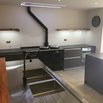 Glass spalshbacks about to be installed in kitchen in North Oxford.