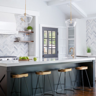 Inspiration for a transitional dark wood floor and brown floor open concept kitchen remodel in Raleigh with an undermount sink, shaker cabinets, gray backsplash, marble backsplash, an island, white countertops, stainless steel appliances and black cabinets