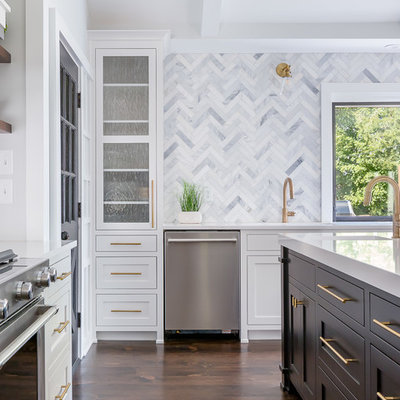 Kitchen - large transitional l-shaped dark wood floor and brown floor kitchen idea in Raleigh with an undermount sink, shaker cabinets, white cabinets, quartzite countertops, gray backsplash, marble backsplash, stainless steel appliances, an island and white countertops