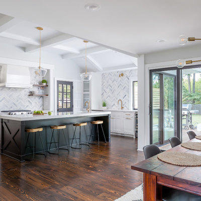 Example of a large transitional u-shaped dark wood floor and brown floor eat-in kitchen design in Raleigh with an undermount sink, shaker cabinets, white cabinets, quartzite countertops, gray backsplash, marble backsplash, stainless steel appliances, an island and white countertops