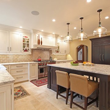 Glazed White Kitchen with Large Dark Stained Island and Built in Refrigerator