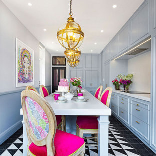 Inspiration for a mid-sized eclectic galley separate kitchen in Sydney with a double-bowl sink, beaded inset cabinets, blue cabinets, quartz benchtops, white splashback, ceramic floors, with island and white benchtop.